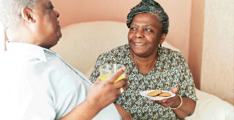 man and woman having a cup of tea