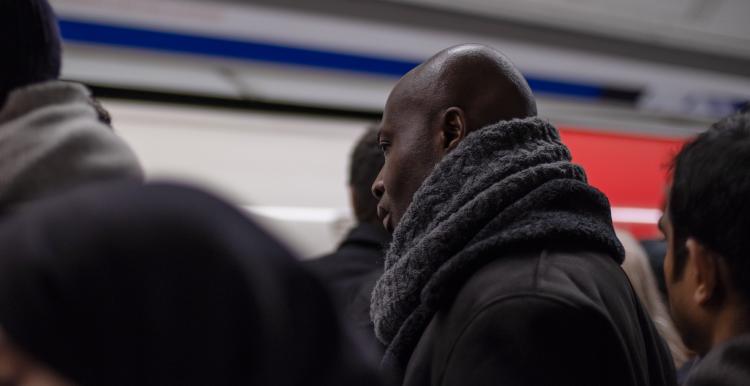 man at tube station